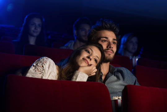 Young Loving Couple At The Cinema