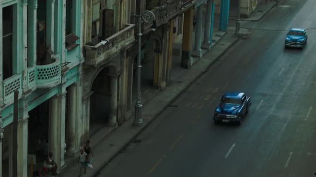 Row of classic cars on the street in Havana seen from above