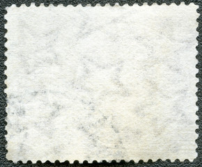 Blank postage stamp sheet on a black background