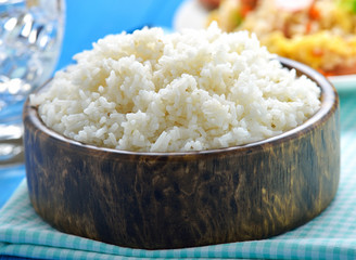 rice in the wood bowl on table