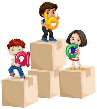 Children holding alphabets on boxes