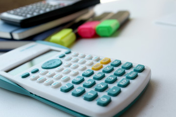 Calculator, pens and notebook 