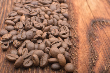 Coffee bean background on wooden texture