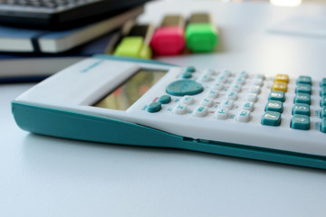 Calculator, pens and notebook 