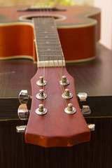 Close up of a guitarist playing a guitar with a plectrum
