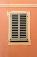 retro decorative wooden shutters on the exterior of the urban building