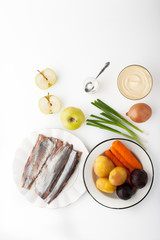 Ingredients for vegetable salad with apple and fish top view