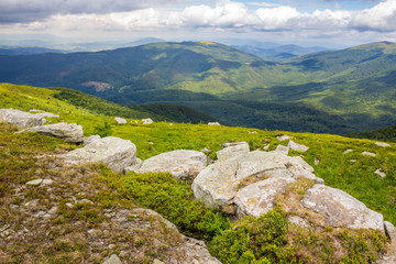 Fototapeta na wymiar landscape with white sharp boulders on the hillside near mountain peak