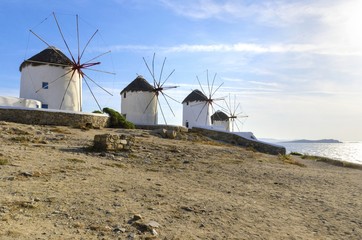 Five windmills in Chora,Mykonos,Greece.Traditional greek whitewashed architecture,a popular landmark,tourist destination on the island of winds,deep blue sky,Aegean sea. Wind mills are now decorative. © f8grapher