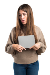 Girl holding an empty placard