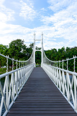 Obraz premium White bridge in city park at Bung Ta Lua Water Park Nakhon Ratch