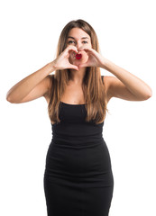 Girl making a heart with her hands