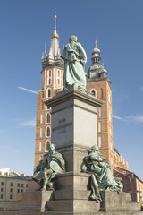 Obraz premium Poland, Krakow, Mickiewicz Monument, st Mary Curch Towers, Midday