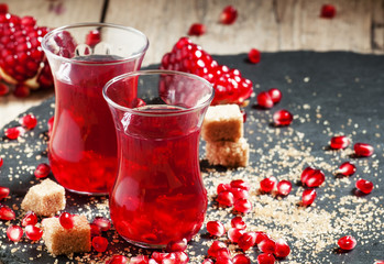 Hot red tea with pomegranate and cane sugar in authentic Middle