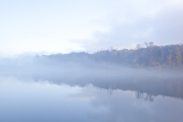 A foggy sunrise on Onota Lake in the Berkshire Mountains of Western Massachusetts.
