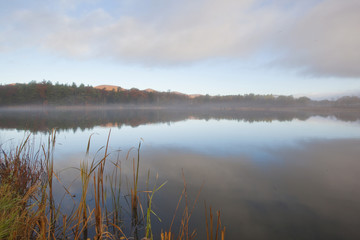 A foggy sunrise on Onota Lake in the Berkshire Mountains of Western Massachusetts.