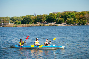 People of all ages in a kayak. Family holiday.