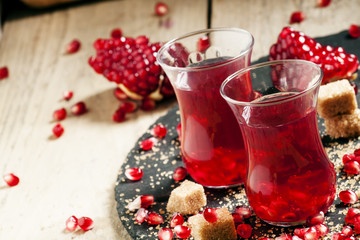 Hot red tea with pomegranate and cane sugar in authentic Middle