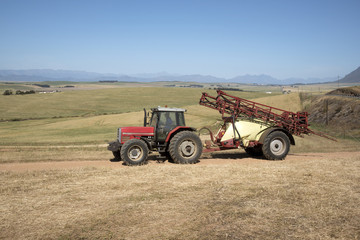Farm tractor and crop sprayer in the Swartland region of South Africa