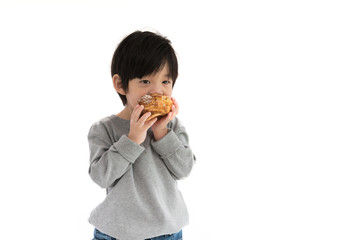 Asian boy holding choux cream isolated