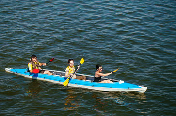 Young people in canoes. Family holiday.