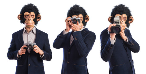 Monkey man photographing over white background
