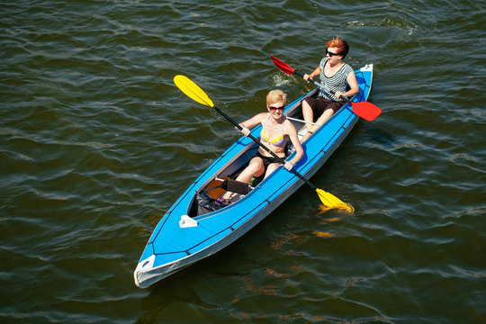 Young people in canoes. Family holiday.