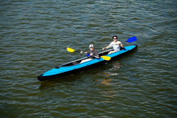 Young people in canoes. Family holiday.