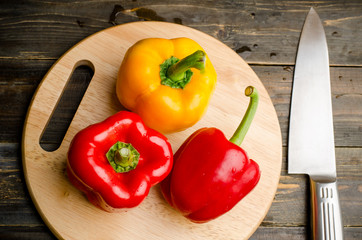 Bell pepper or sweet pepper on wooden plate ready to cooking