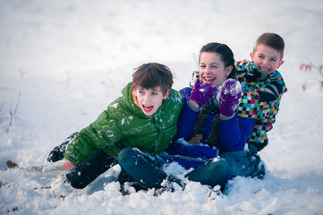 Fototapeta na wymiar Happy children in snowdrift outside