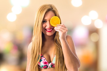 Young woman with orange slice