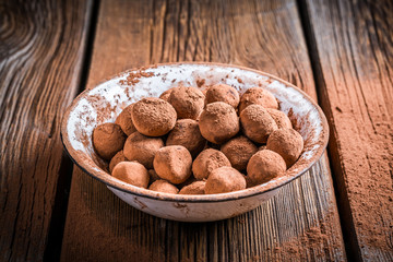 Sweet chocolate balls and cocoa powder