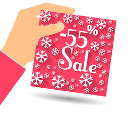 Winter sale. Discount 55 percent. Hand holds percent discount on the price. Gift card with a winter pattern with snowflakes in a flat style.