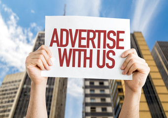 Advertise With Us placard with urban background