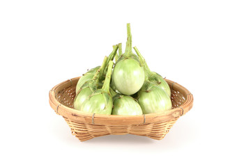 green eggplant in basket isolated on white