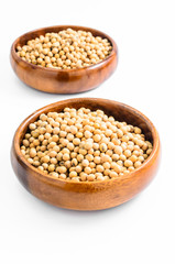soybeans in wooden bowl isolated on white background..