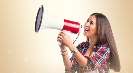 Woman shouting by megaphone