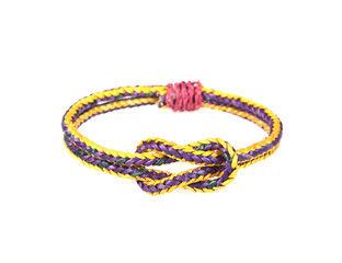 wristband made from woven straw on a white background.