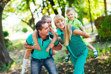 Happy family in the park. Happiness.