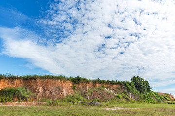 Wall cliff - clay brown soil and grass