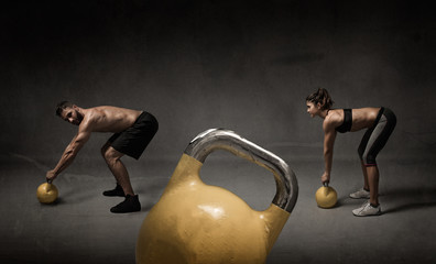 personal trainer and student with kettleball