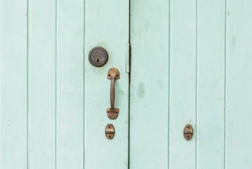 Fototapeta premium Closeup old and pale green wooden door background