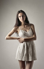 Fototapeta premium Beautiful woman wearing a short dress