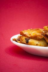 Octopus with paprika on a white plate, also known as Galician oc