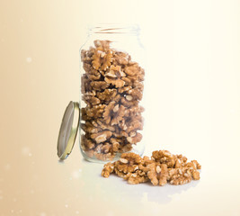 Shelled walnuts inside jar glass
