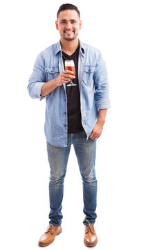 Happy guy drinking a glass of beer