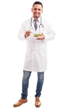 Male nutriologist with a salad