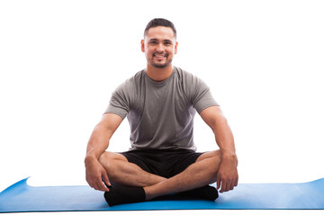 Happy young man in yoga class