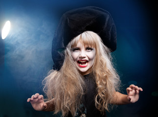 children wearing as witch and vampire for halloween