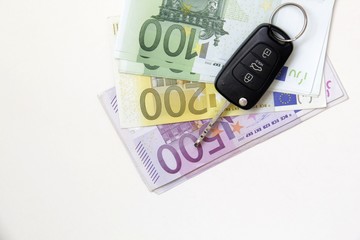 Car keys on euro banknotes with copy space